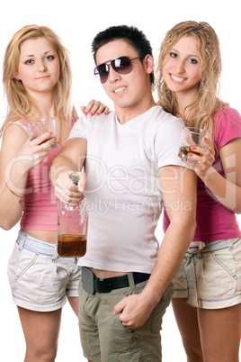 Smiling young people with a bottle of whiskey