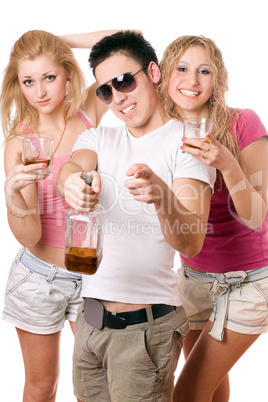 Happy young people with a bottle of whiskey