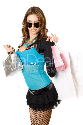 Happy young woman after shopping. Isolated on white