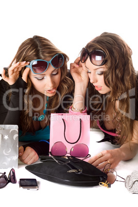 Two pretty girlfriends in sunglasses