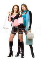 Two attractive young women after shopping. Isolated