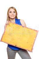 Pretty young woman posing with yellow vintage board