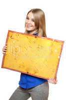 Cheerful young woman posing with yellow vintage board