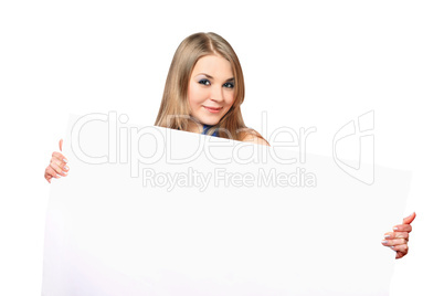 Cheerful young woman posing with white board