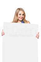 Happy young woman posing with white board
