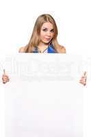 Pretty young woman posing with white board