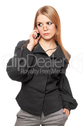Portrait of dissatisfied young blonde in a gray business suit