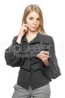 Portrait of thoughtful young blonde in a gray business suit