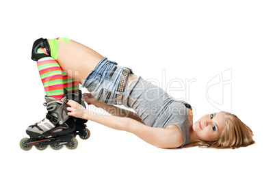 Lying pretty girl in roller skates