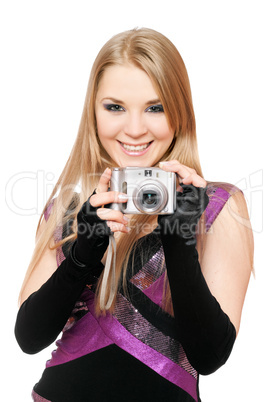 Smiling blonde holding a photo camera. Isolated