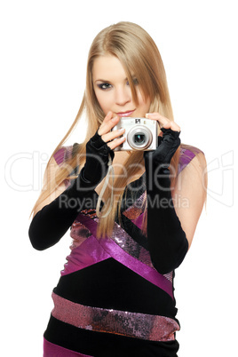 Young pretty blonde holding a photo camera. Isolated