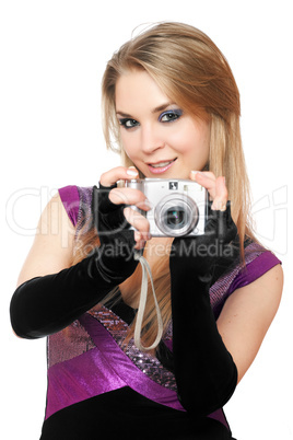 Playful blonde holding a photo camera. Isolated