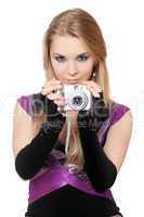 Young attractive blonde holding a photo camera. Isolated