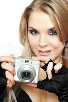 Smiling beautiful woman holding a photo camera