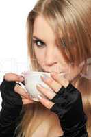 Beautiful young blonde with a cup of tea. Isolated