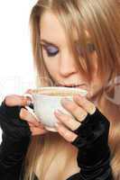 Pretty young blonde with a cup of tea. Isolated