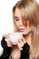 Attractive young blonde with a cup of tea. Isolated