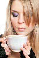 Beautiful blonde with a cup of tea. Isolated