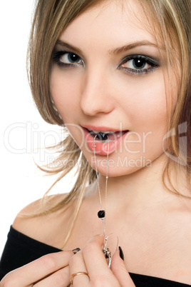 Portrait of beautiful young woman with a bead