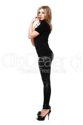 Seductive young woman in leggings. Isolated on white