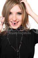 Portrait of smiling girl with a bead in her mouth
