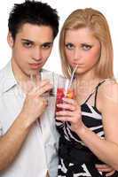 Attractive young couple with cocktails. Isolated