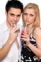 Young couple with cocktails. Isolated