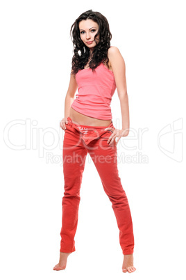 Sexy young brunette in a red jeans