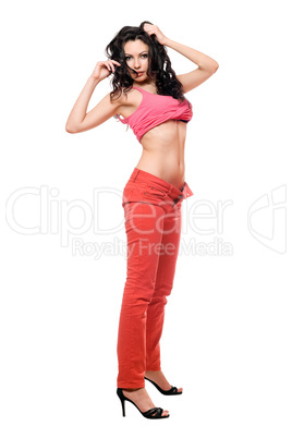 Sexy beautiful brunette in a red jeans