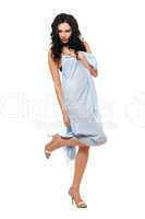 Playful young brunette wrapped in blue cloth