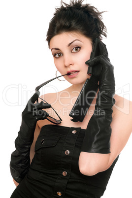 Portrait of surprised young woman talking on the phone