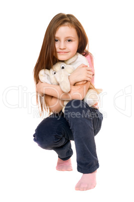 Beautiful little girl with a teddy elephant