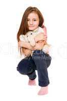 Beautiful little girl with a teddy elephant