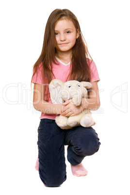 Pretty little girl with a teddy elephant