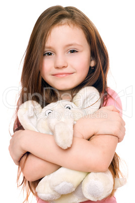 Portrait of smiling little girl with a teddy elephant