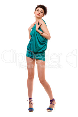 Playful young woman in a blue dress. Isolated