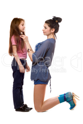 Attractive young mother and little daughter. Isolated