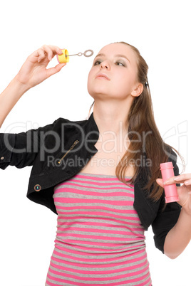 Portrait of pretty young woman blow bubbles