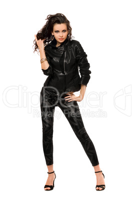 Attractive young brunette in black clothes. Isolated