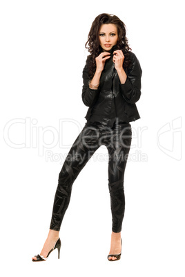 Charming young brunette in black clothes. Isolated