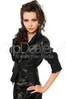 Portrait of pretty young brunette in black clothes. Isolated