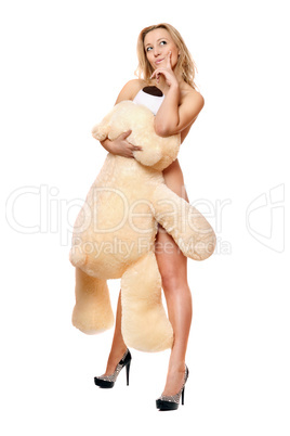 woman posing with large teddy bear