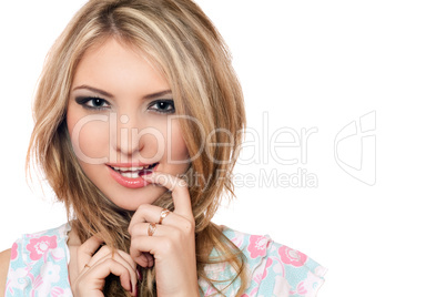 Closeup portrait of playful young blonde. Isolated