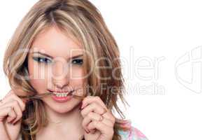 Closeup portrait of passionate young blonde. Isolated