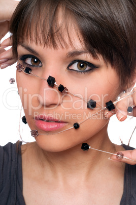 Closeup portrait of brunette with a bead
