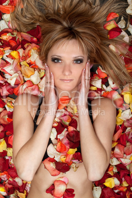 blonde lying in rose petals