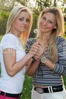 Two smiling young blonde