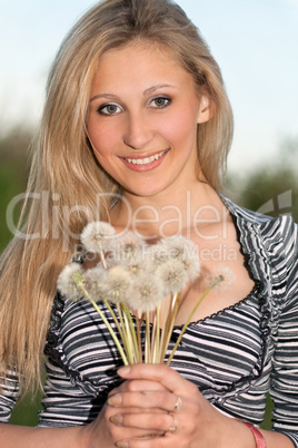 attractive blonde with a dandelions