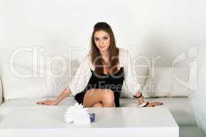 girl siting on a white sofa