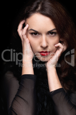 Closeup portrait of mysterious young woman. Isolated